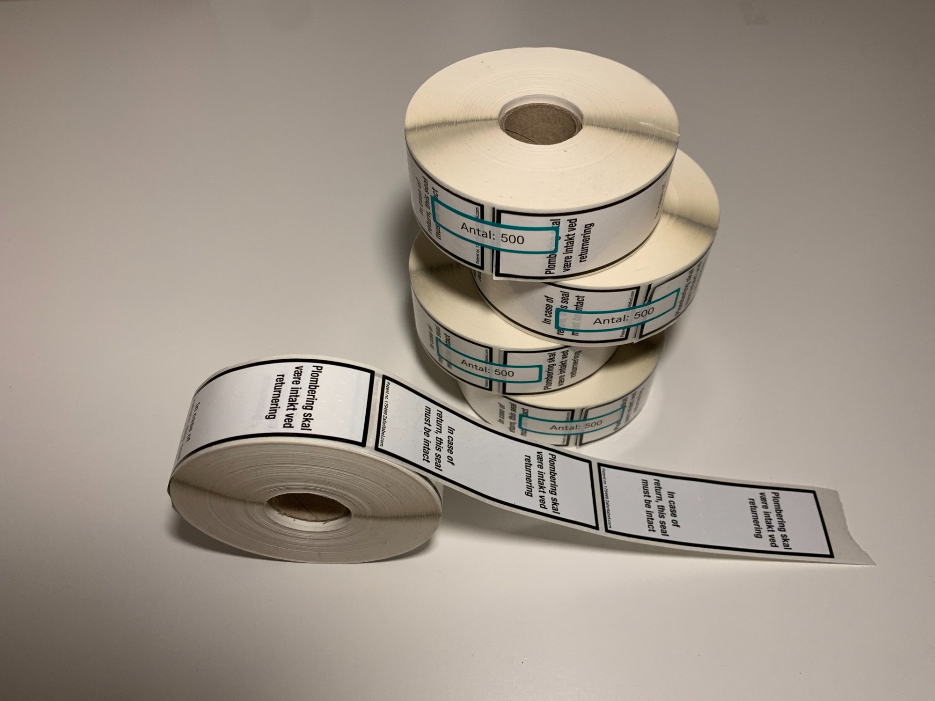 CleverSeal patented return-control label rolls, in a clean studio setting.